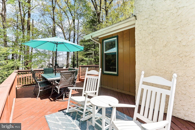 wooden deck with outdoor dining space