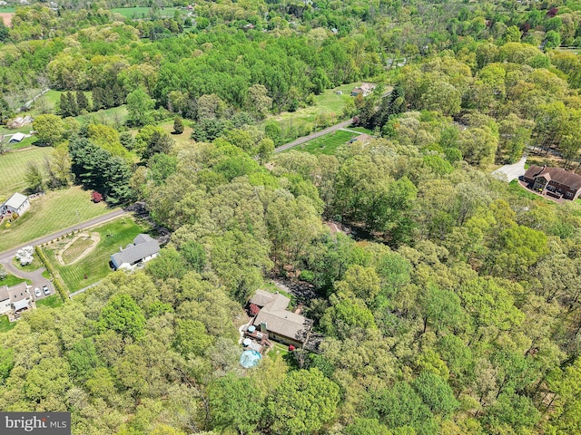 drone / aerial view with a view of trees