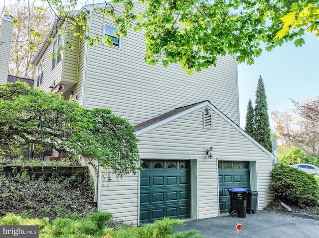 view of home's exterior featuring aphalt driveway