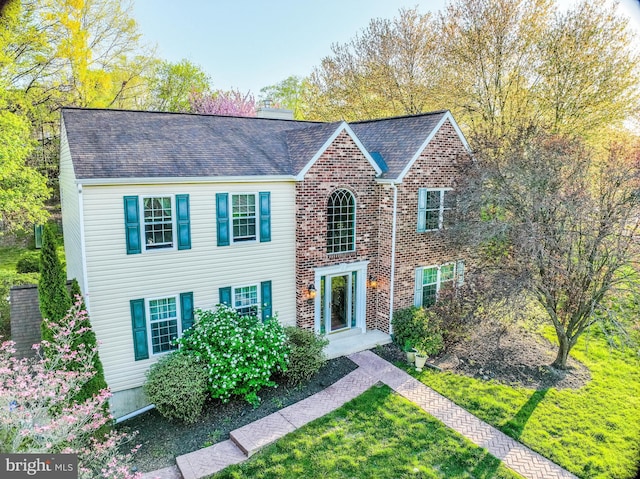 view of front of home featuring brick siding
