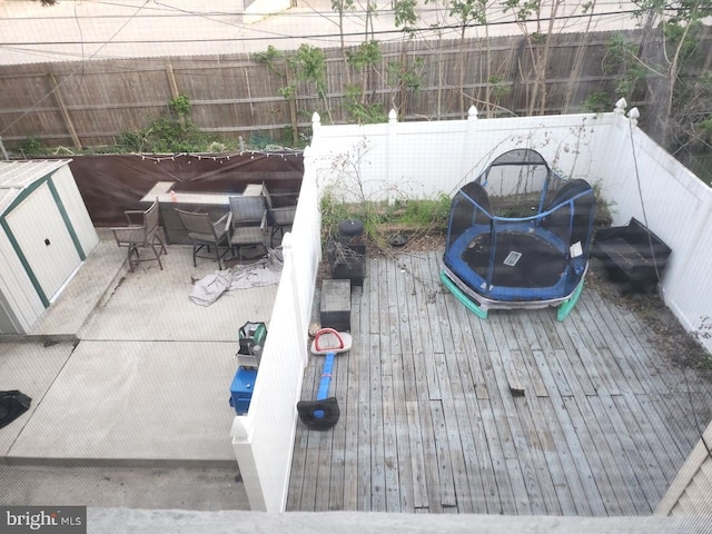 exterior space with a fenced backyard and a wooden deck