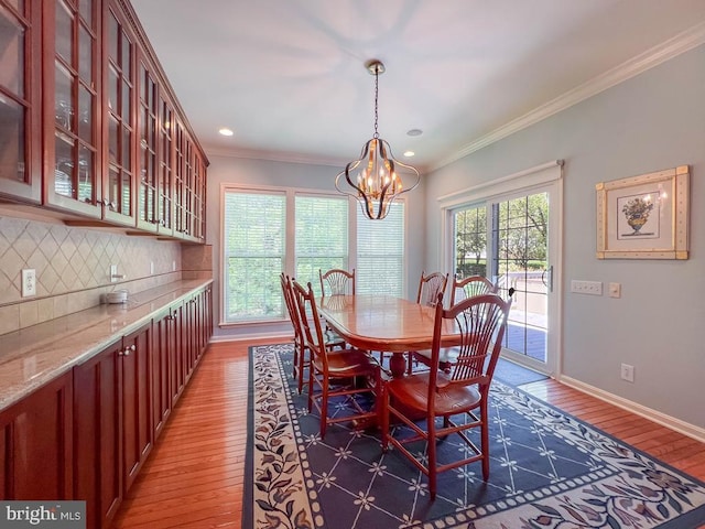 11 Mcconkey Dr, Washington Crossing, PA 18977 - dining space featuring recessed lighting, baseboards, ornamental molding, an inviting chandelier, and hardwood / wood-style floors