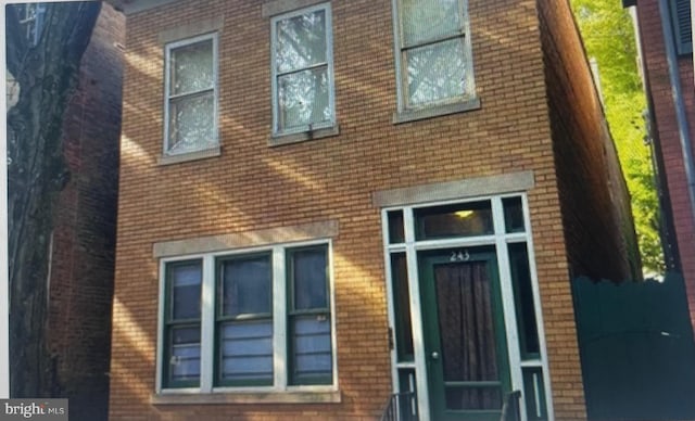 exterior space with brick siding