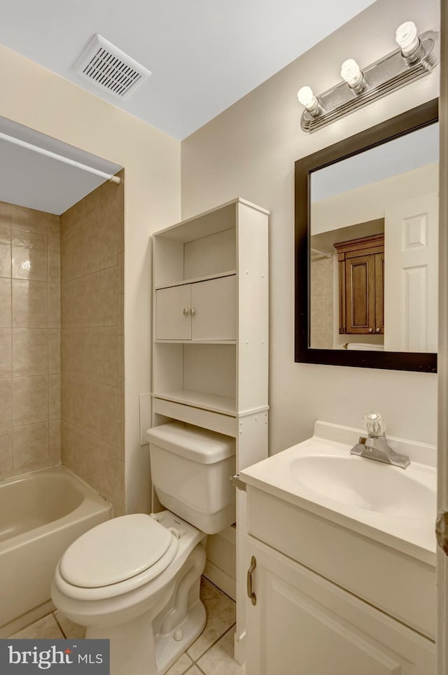bathroom with toilet, visible vents, tile patterned flooring, and vanity