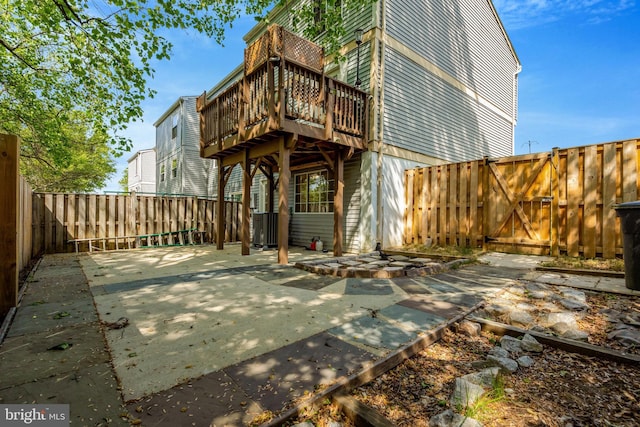 back of house featuring a patio, central AC, and a fenced backyard