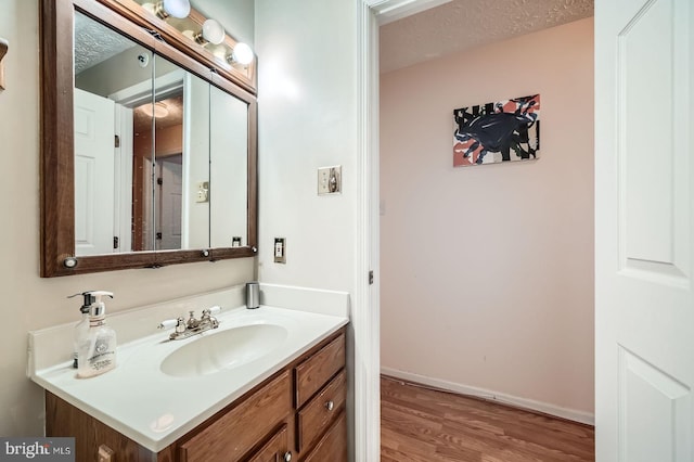 1317 Greenbriar Cir Unit 7-1317, Pikesville, MD 21208 - bathroom featuring wood finished floors, vanity, and baseboards