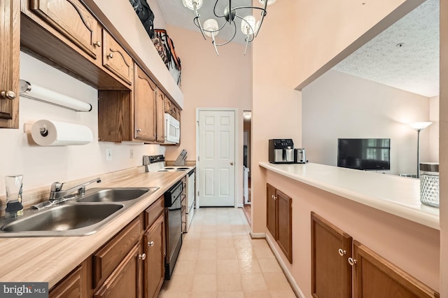 1317 Greenbriar Cir Unit 7-1317, Pikesville, MD 21208 - kitchen featuring white microwave, a sink, black dishwasher, and light countertops