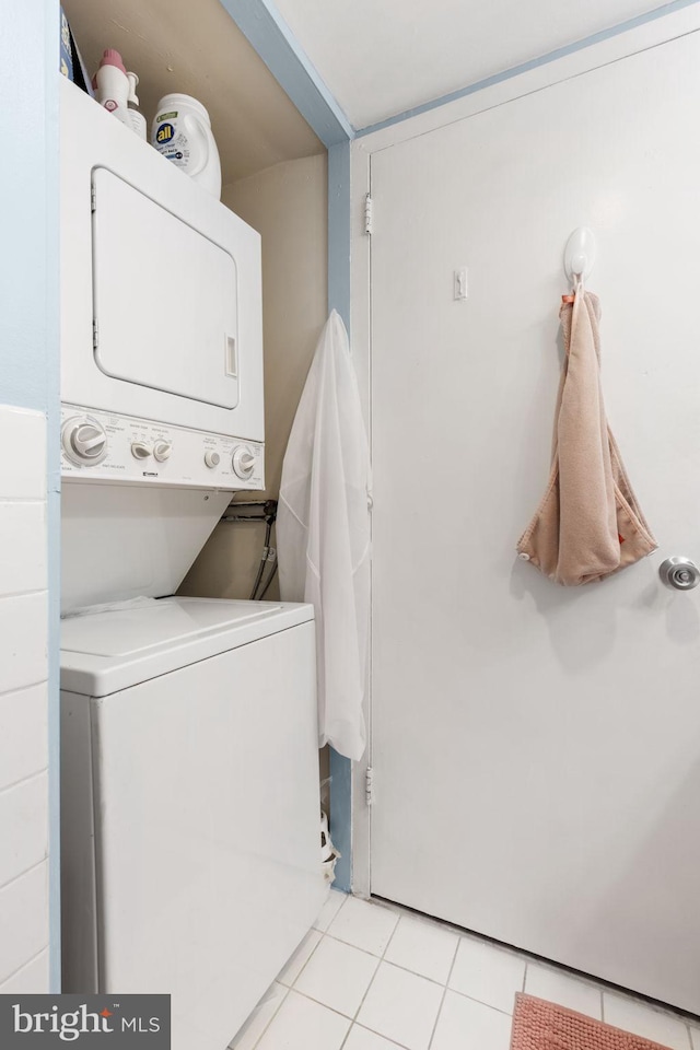 3600 Conshohocken Ave Unit 1810, Philadelphia, PA 19131 - laundry room with laundry area, stacked washing maching and dryer, and light tile patterned flooring