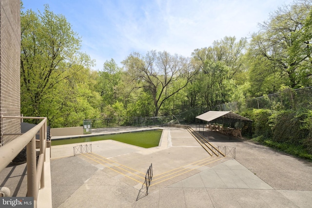 3600 Conshohocken Ave Unit 1810, Philadelphia, PA 19131 - view of patio / terrace with fence, a view of trees, a carport, and a gazebo