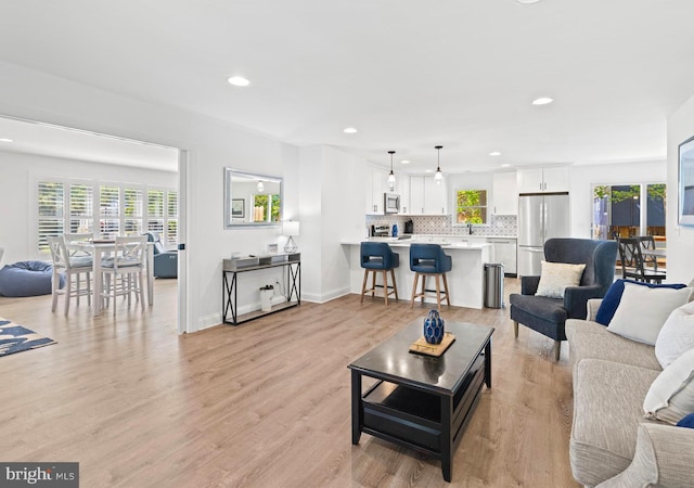 327 Oakwood St, Bethany Beach, DE 19930 - living room featuring recessed lighting, light wood finished floors, and baseboards