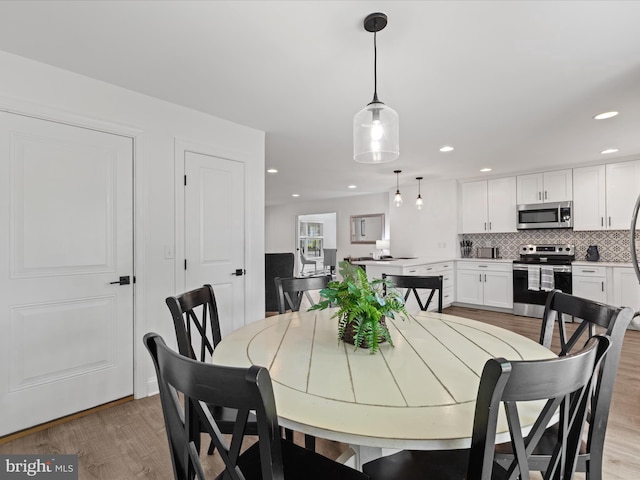 327 Oakwood St, Bethany Beach, DE 19930 - dining space featuring light wood finished floors and recessed lighting
