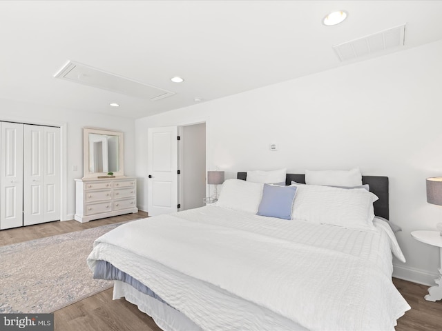 327 Oakwood St, Bethany Beach, DE 19930 - bedroom with attic access, wood finished floors, baseboards, and recessed lighting