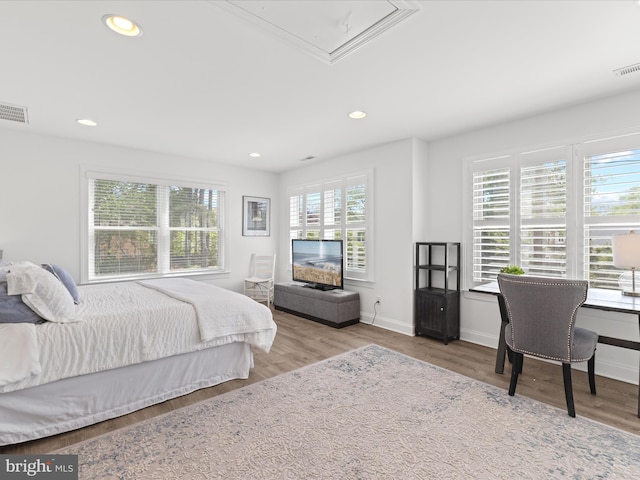 327 Oakwood St, Bethany Beach, DE 19930 - bedroom with wood finished floors, attic access, baseboards, and recessed lighting