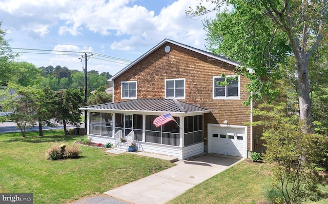 327 Oakwood St, Bethany Beach, DE 19930 - view of front of property featuring a sunroom, a garage, driveway, a standing seam roof, and a front yard