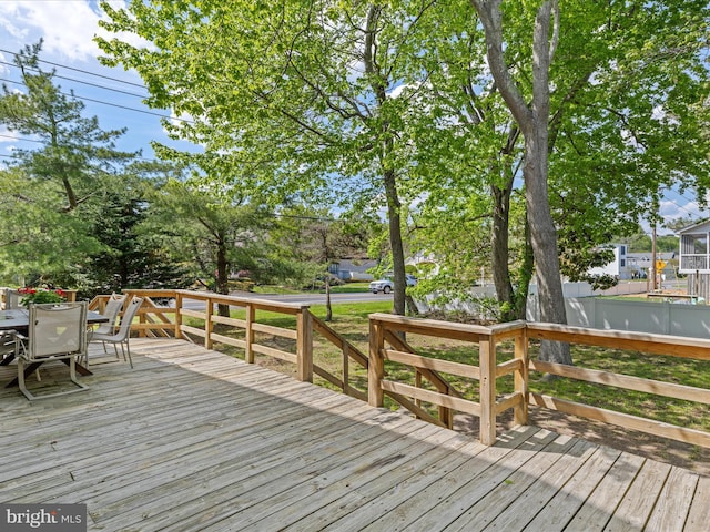 327 Oakwood St, Bethany Beach, DE 19930 - wooden deck featuring outdoor dining space and fence