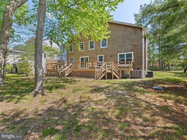 327 Oakwood St, Bethany Beach, DE 19930 - rear view of property featuring a wooden deck, stairway, a lawn, and central AC