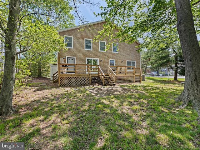 327 Oakwood St, Bethany Beach, DE 19930 - rear view of house featuring a lawn and a wooden deck