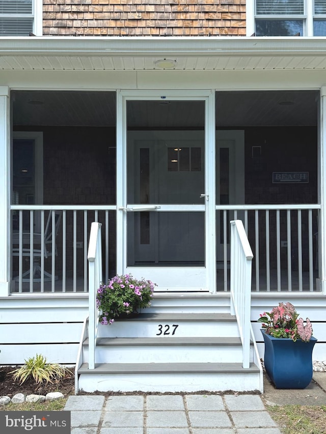 327 Oakwood St, Bethany Beach, DE 19930 - property entrance with a shingled roof