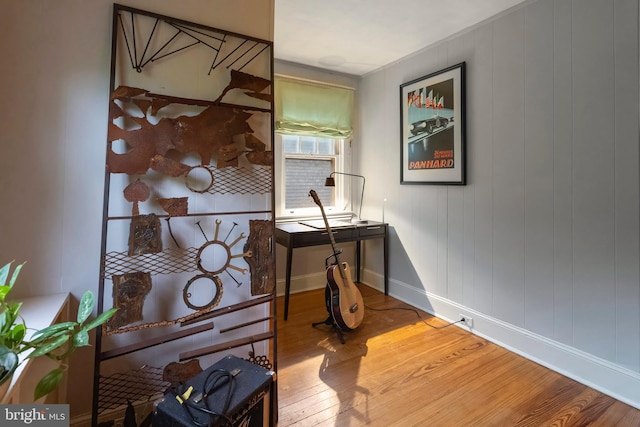 office area with wood finished floors and baseboards