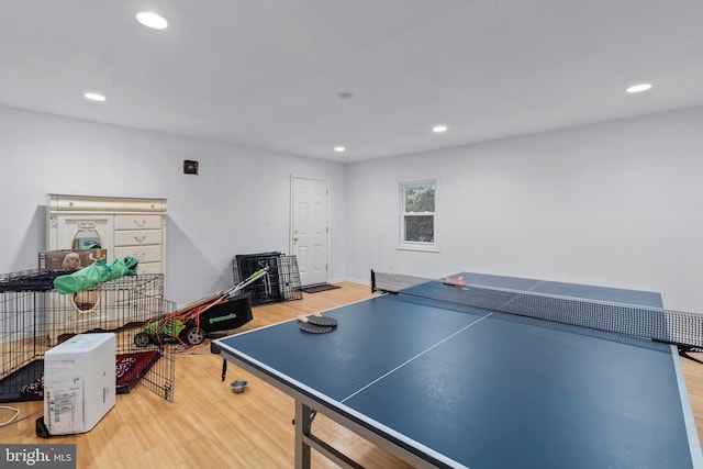 game room with wood finished floors and recessed lighting