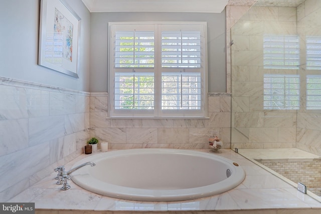 full bathroom with a garden tub