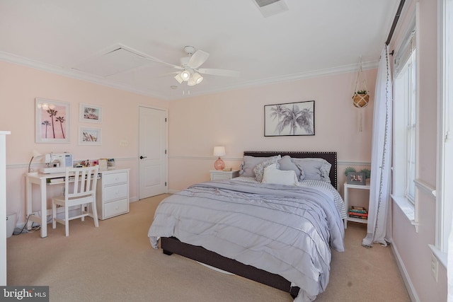bedroom featuring crown molding, light carpet, attic access, a ceiling fan, and visible vents