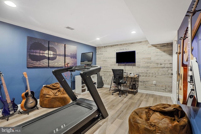 workout area with baseboards, recessed lighting, wood finished floors, and ornamental molding