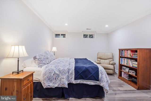 bedroom with recessed lighting, ornamental molding, light wood-type flooring, and visible vents