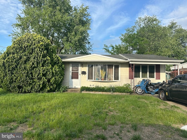 ranch-style house with a front yard