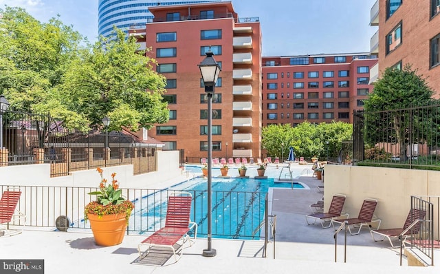 1021 Arlington Blvd Unit 928, Arlington, VA 22209 - community pool with a patio and fence