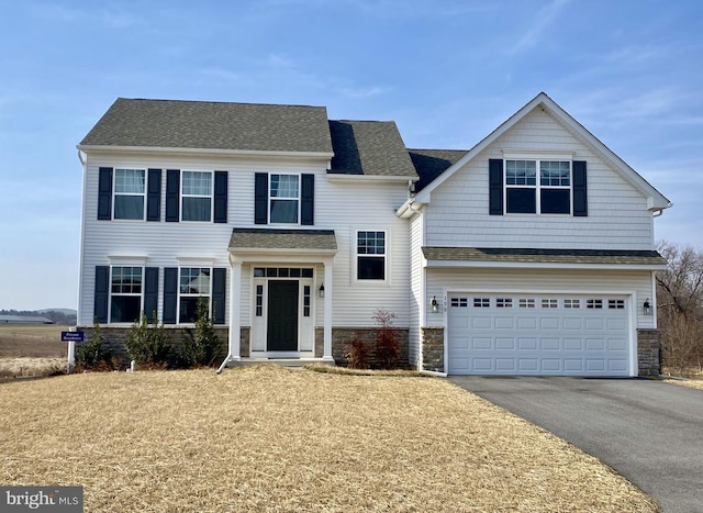 190 Petrelia Dr, Honey Brook, PA 19344 - traditional home featuring a shingled roof, an attached garage, aphalt driveway, and stone siding