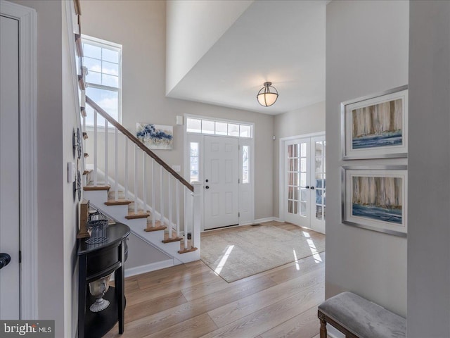 190 Petrelia Dr, Honey Brook, PA 19344 - foyer with baseboards, stairs, wood finished floors, and french doors