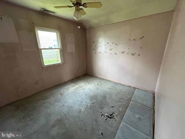 3129 Sollers Point Rd, Baltimore, MD 21222 - spare room featuring concrete floors and a ceiling fan