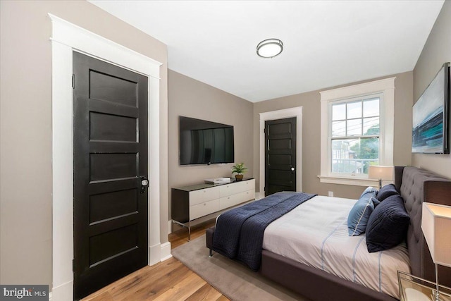 bedroom with light wood-style floors