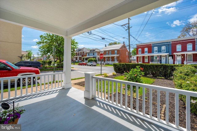 view of patio with covered porch and a residential view