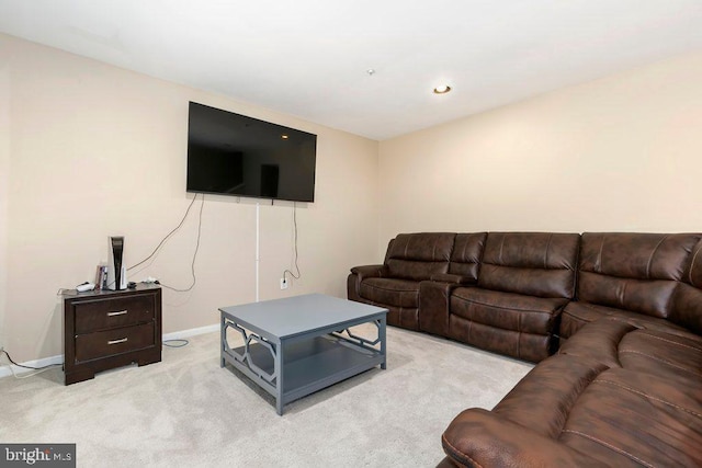 living room featuring baseboards and carpet flooring