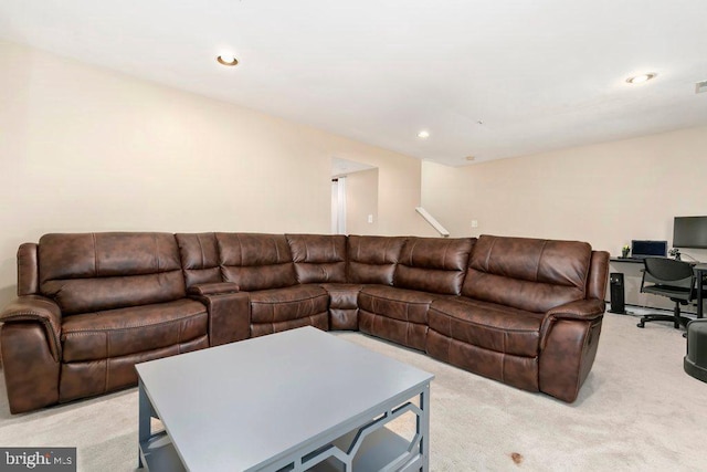 living area with light carpet, visible vents, and recessed lighting