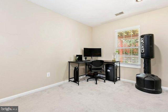 office area with baseboards, visible vents, and carpet floors