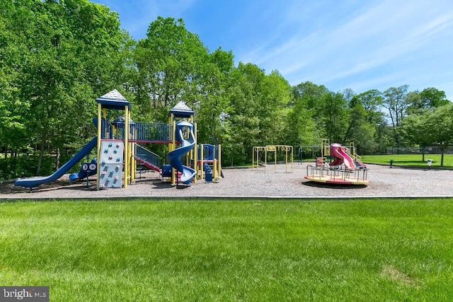 community jungle gym with a lawn