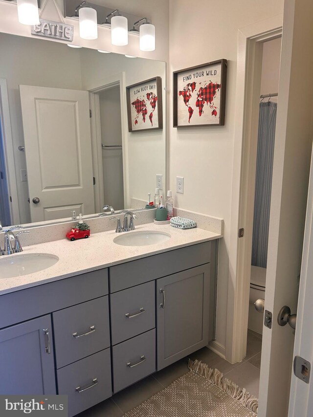 45952 Swallow Ter, Sterling, VA 20165 - bathroom with tile patterned floors and double vanity