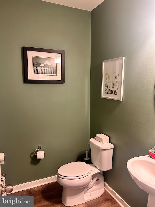 45952 Swallow Ter, Sterling, VA 20165 - bathroom with wood finished floors, baseboards, toilet, and a sink