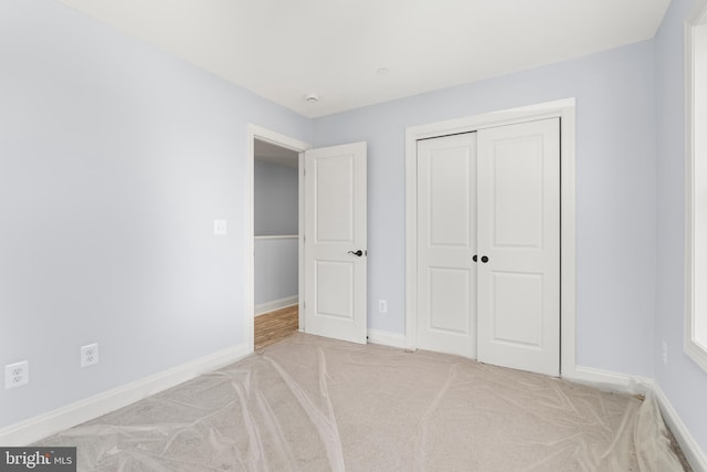 W Main Blvd, Lutherville Timonium, MD 21093 - unfurnished bedroom with carpet floors, baseboards, and a closet
