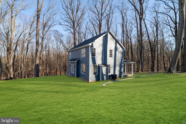 W Main Blvd, Lutherville Timonium, MD 21093 - view of side of home with a lawn and central AC