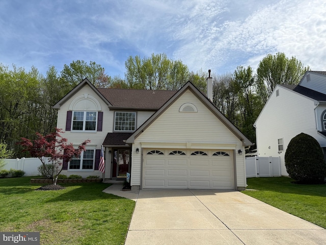 traditional home with a front lawn, a gate, a chimney, concrete driveway, and fence