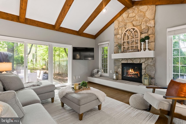 9100 Wood Spice Ln, Lorton, VA 22079 - living room featuring beam ceiling, wood finished floors, high vaulted ceiling, and a fireplace