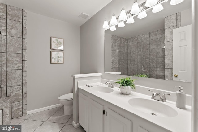 full bath featuring toilet, tile patterned floors, visible vents, and a sink