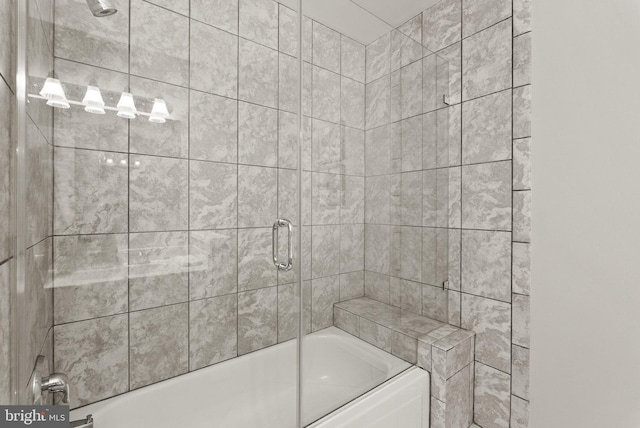 full bathroom with shower / bath combination with glass door