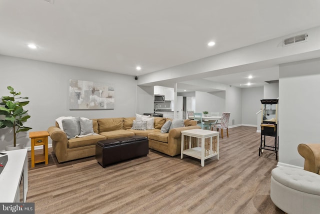 9100 Wood Spice Ln, Lorton, VA 22079 - living area featuring light wood-type flooring, recessed lighting, baseboards, and visible vents