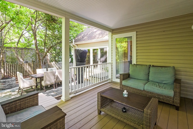 9100 Wood Spice Ln, Lorton, VA 22079 - wooden terrace with fence, outdoor dining space, and an outdoor living space