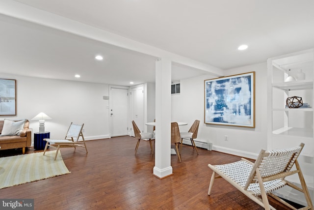 sitting room with recessed lighting, dark wood finished floors, baseboards, and baseboard heating
